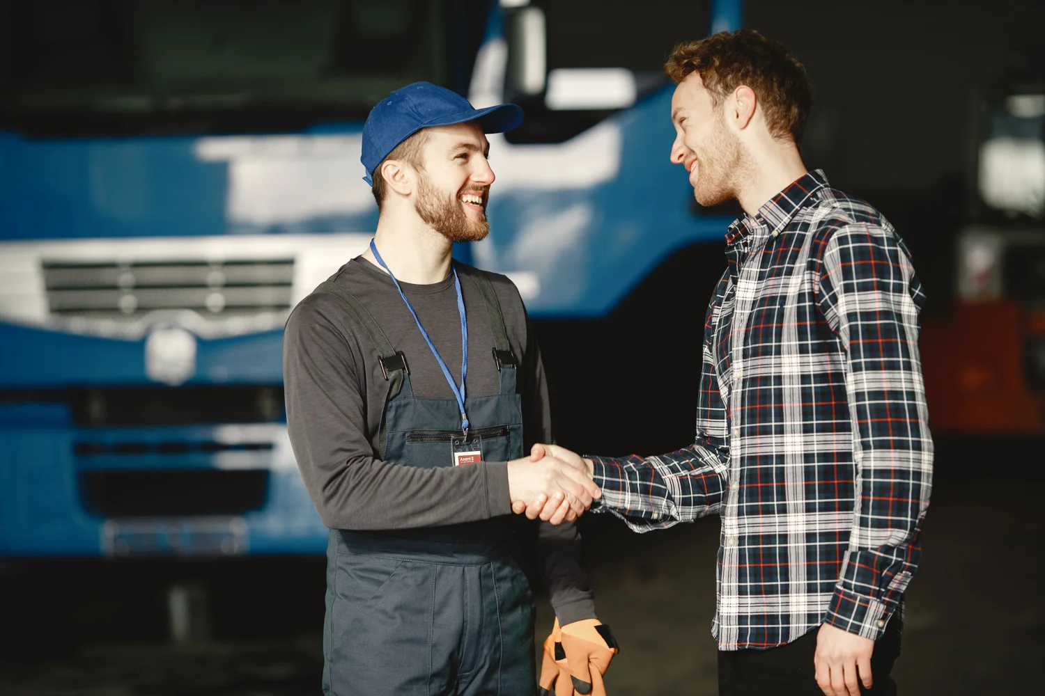 Mechanic and customer discussing a service enquiry in a workshop